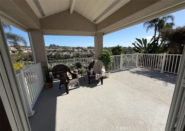 a view of balcony with furniture
