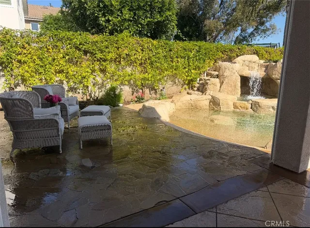 a view of swimming pool with patio