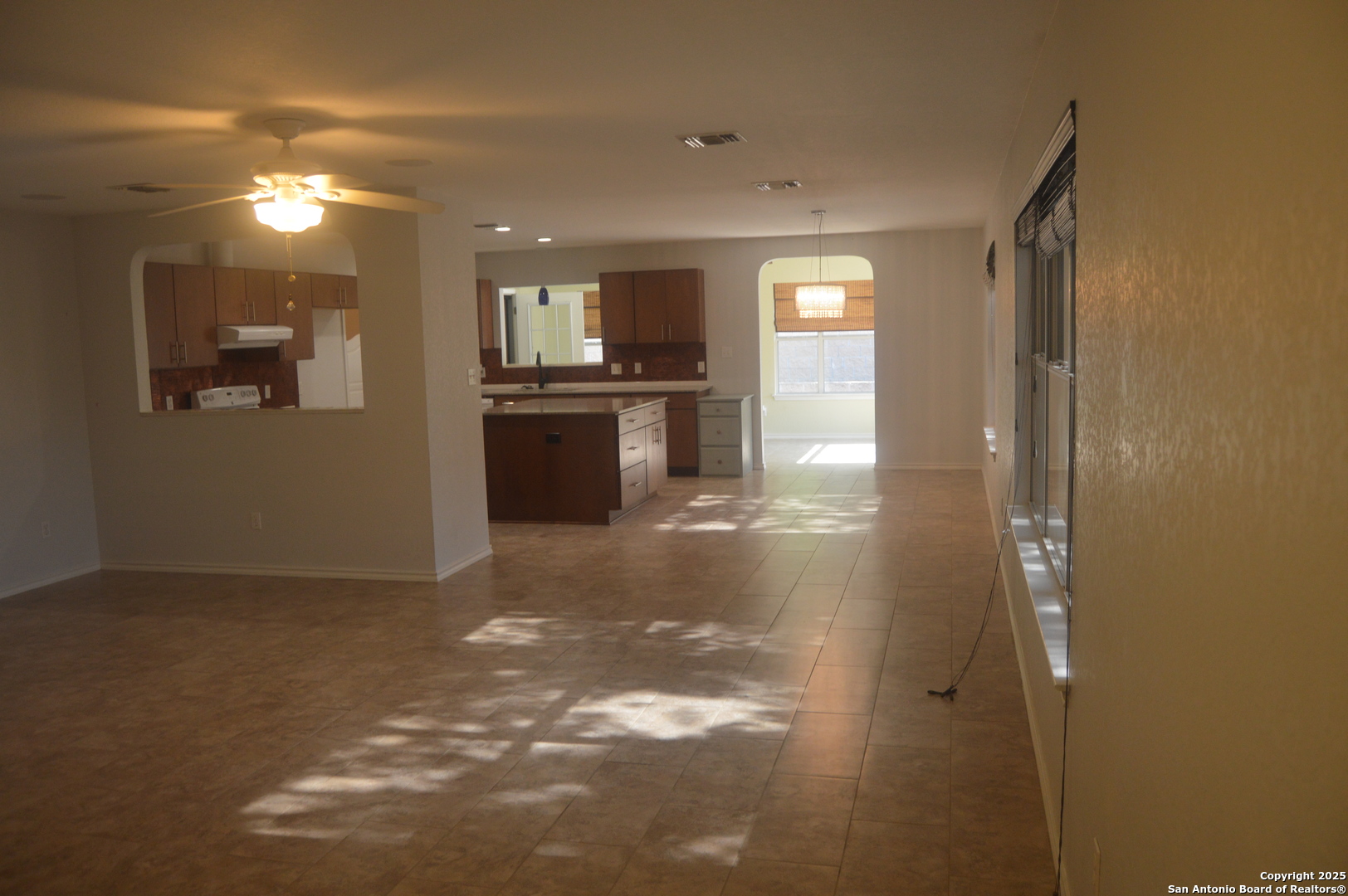 14847 Lytle Somerset Street Lytle, TX 78052 - Photo 18 of 42 a view of kitchen and hall with a flat screen tv