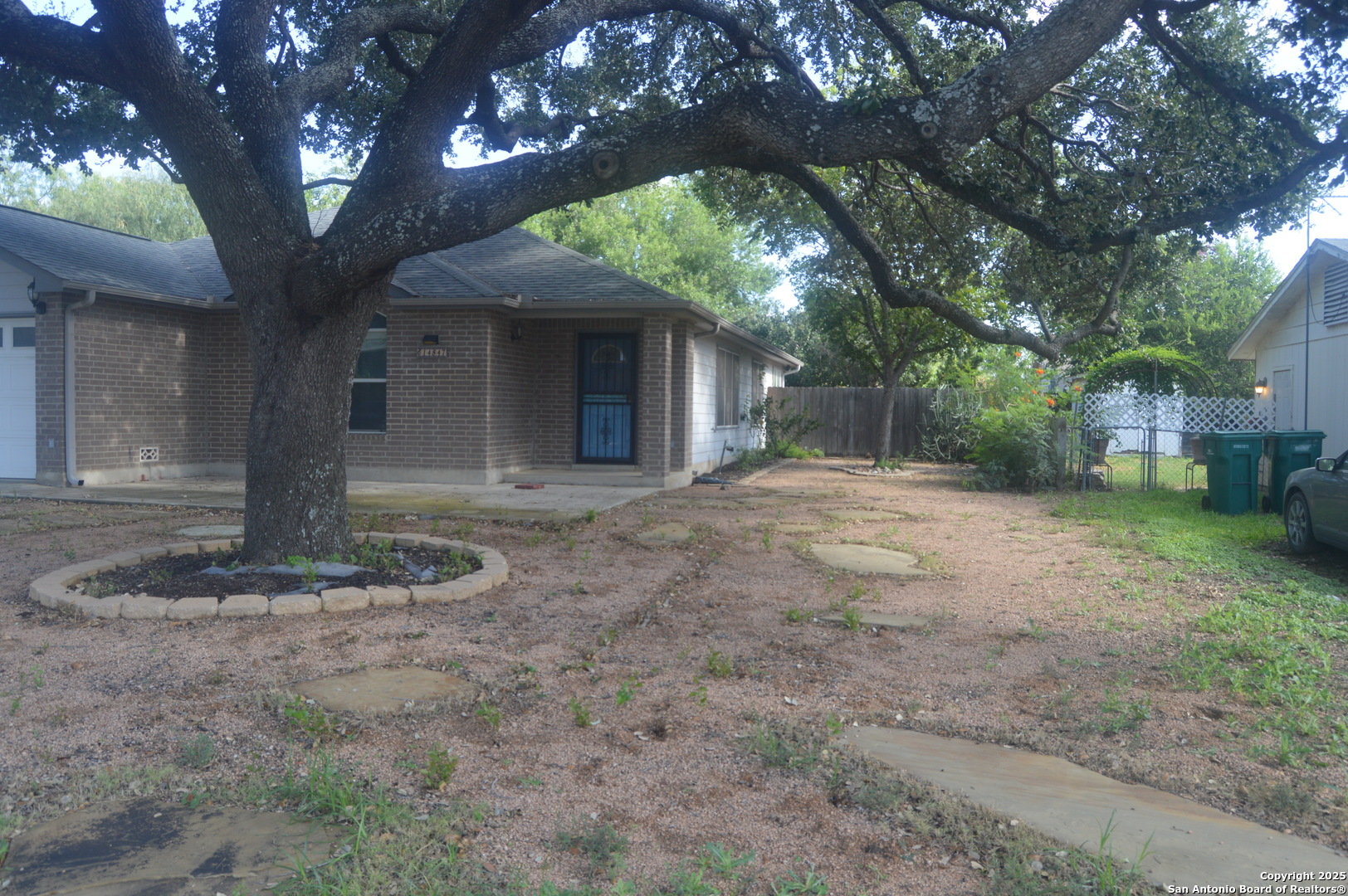 14847 Lytle Somerset Street Lytle, TX 78052 - Photo 2 of 42 a front view of a house with a yard