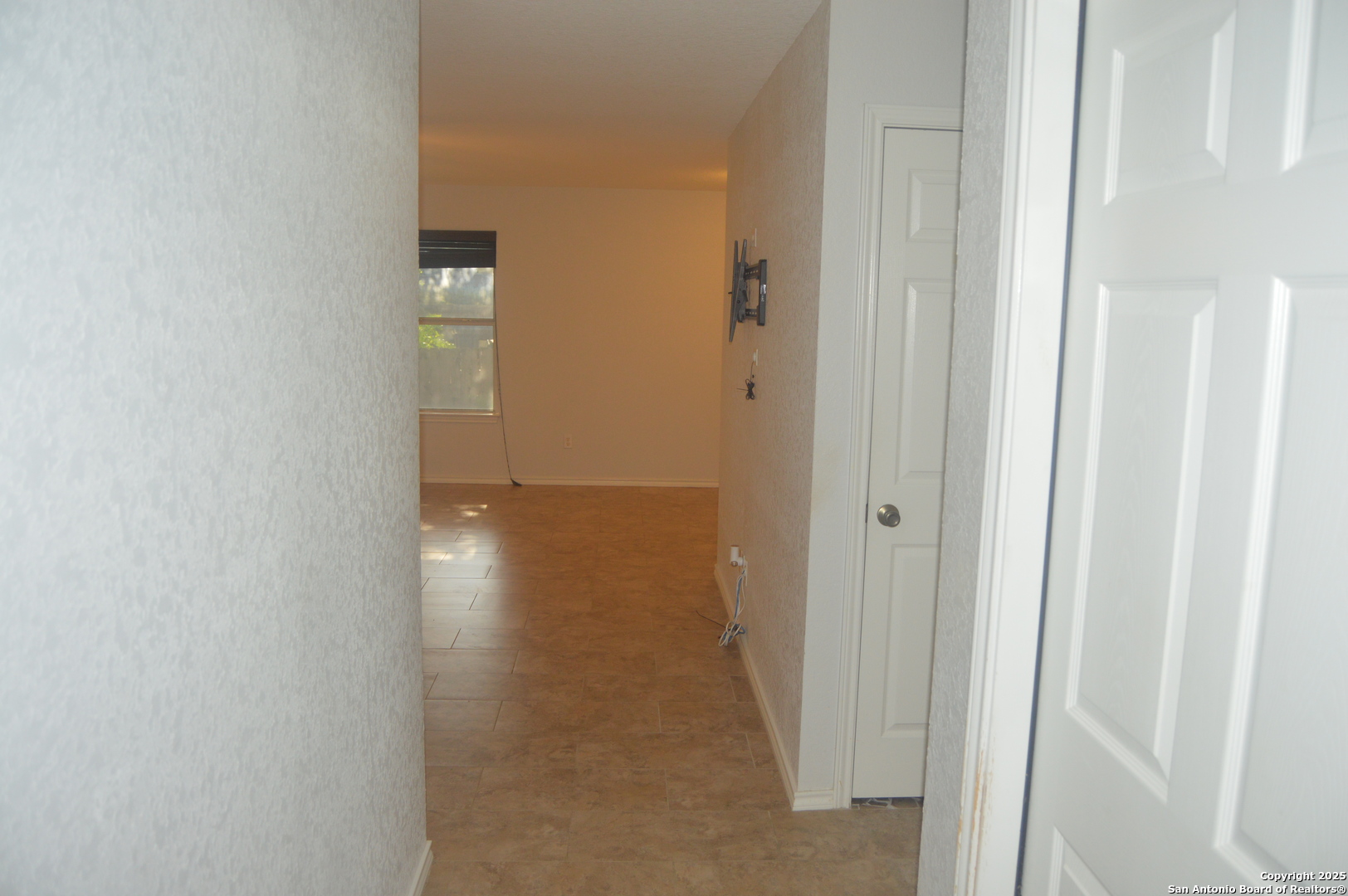 14847 Lytle Somerset Street Lytle, TX 78052 - Photo 24 of 42 a view of a hallway with wooden floor