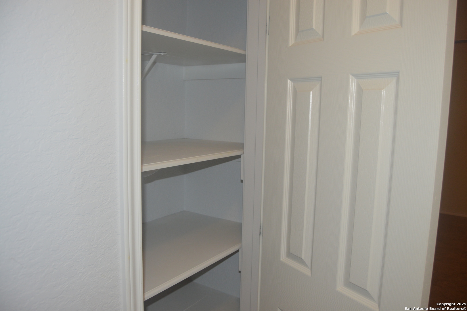 14847 Lytle Somerset Street Lytle, TX 78052 - Photo 28 of 42 a bathroom with a glass shower door