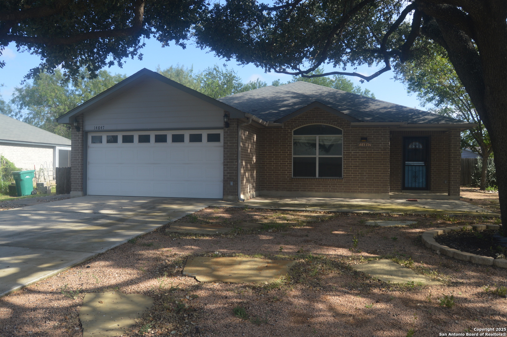 14847 Lytle Somerset Street Lytle, TX 78052 - Photo 3 of 42 a front view of a house with a yard and garage