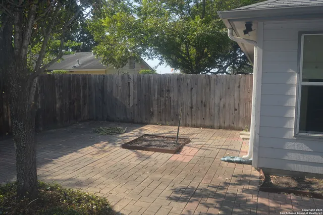 a view of backyard with green space