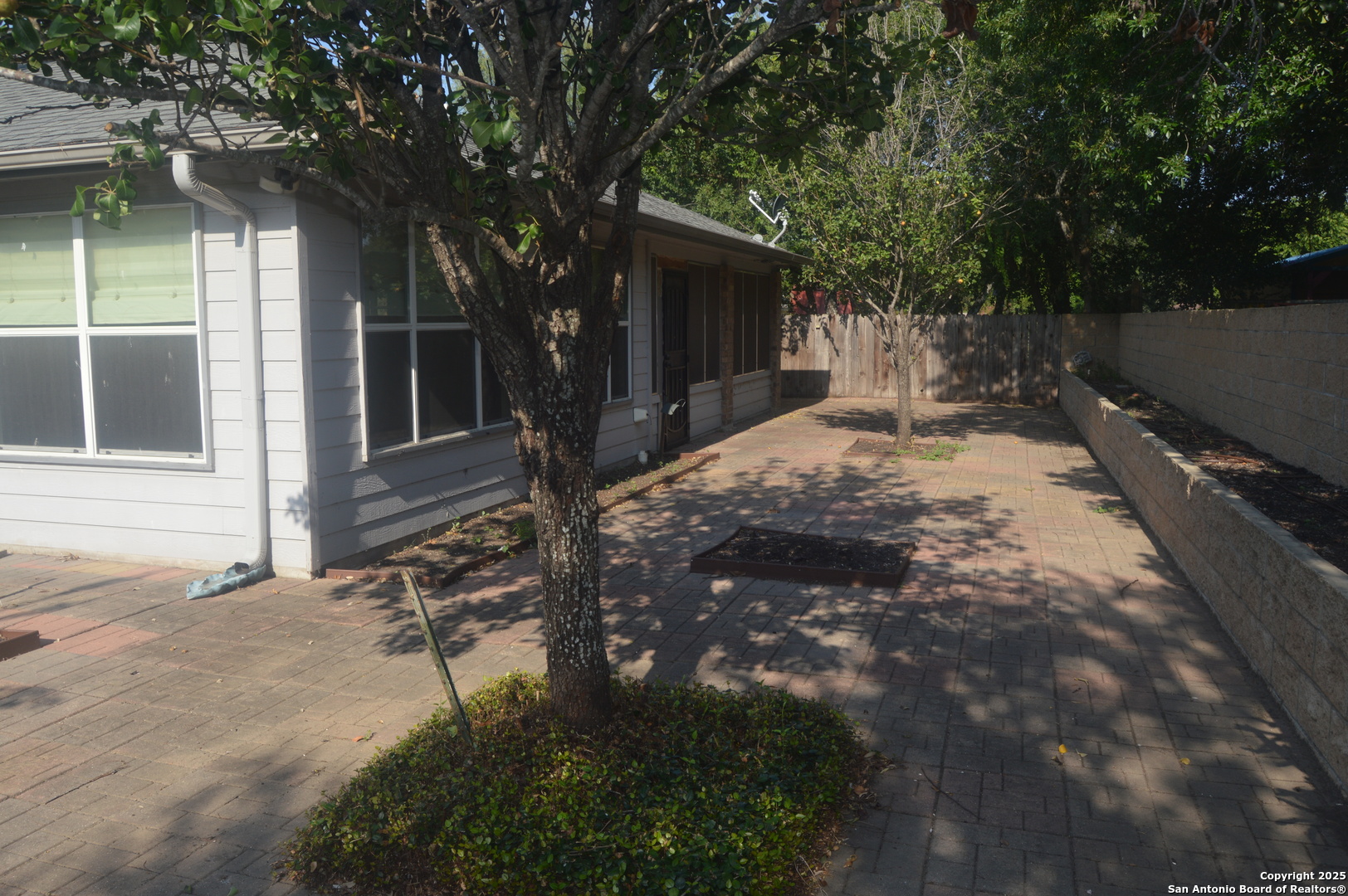 14847 Lytle Somerset Street Lytle, TX 78052 - Photo 41 of 42 a view of a house with a tree in the yard