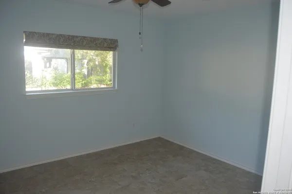 a view of empty room with floor to ceiling window