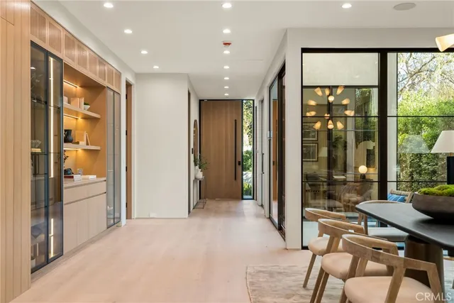 a lobby with furniture and floor to ceiling window