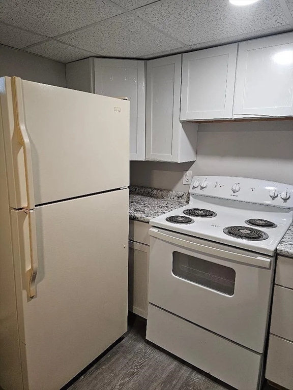 800 Davol Street, Unit 1 Fall River, MA 02720 - Photo 2 of 14 a kitchen with a white stove and refrigerator