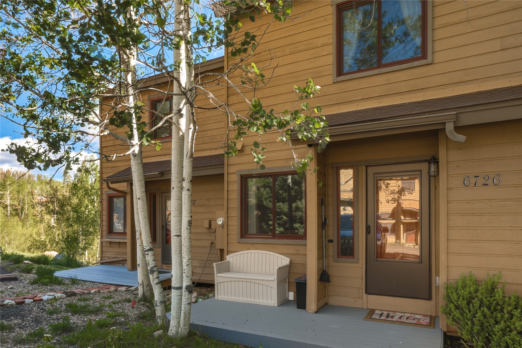 6726 Ryan Gulch Road, Unit 6726 Wildernest, CO 80498 - Photo 3 of 39 a front view of a house with a porch