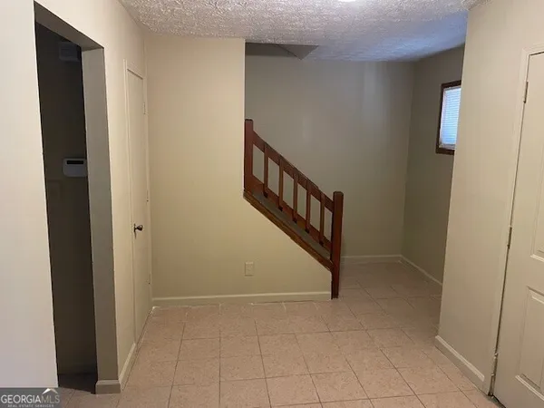 a view of a hallway with stairs