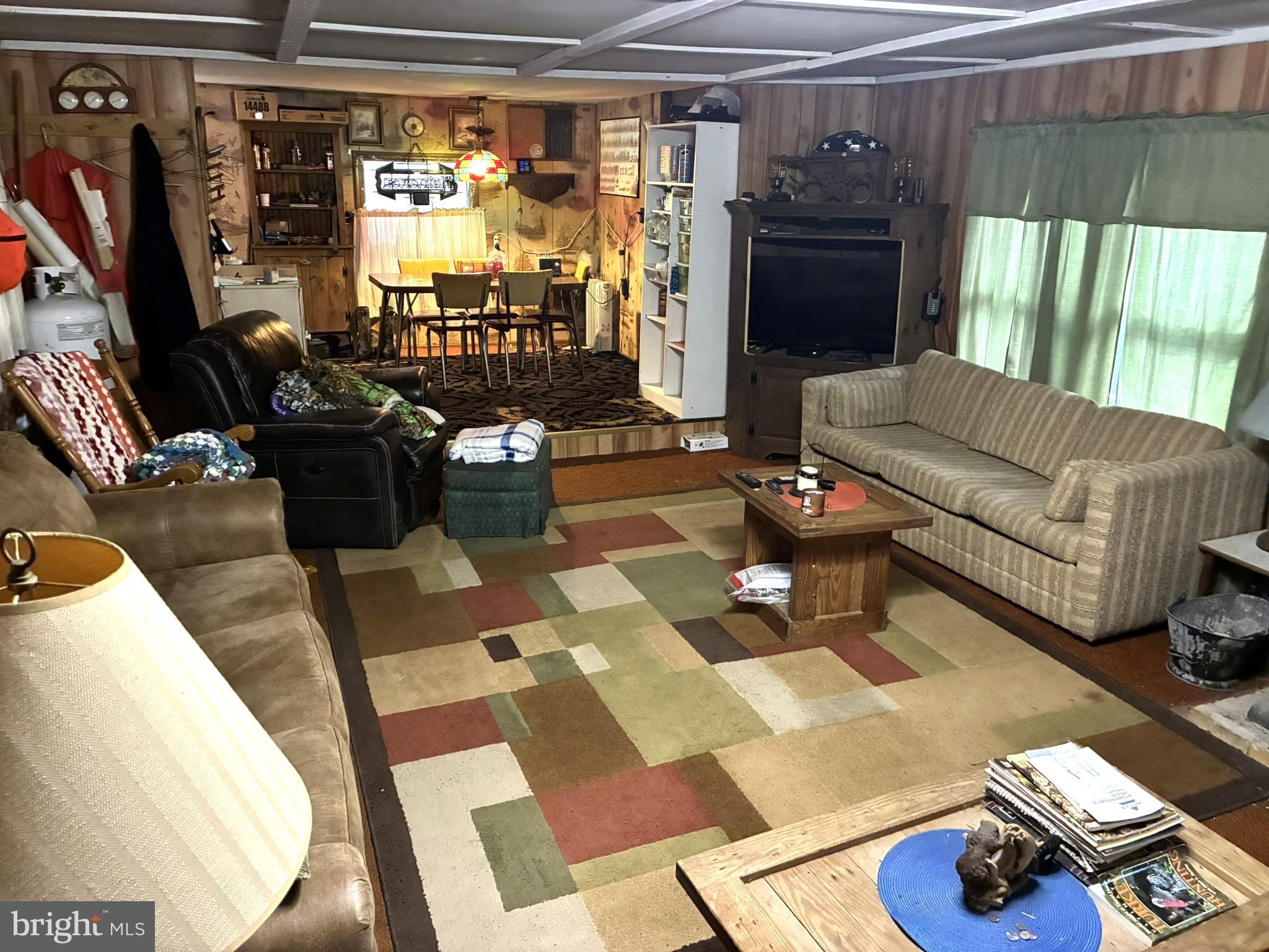 1822 Monument Orviston Road Beech Creek, PA 16822 - Photo 19 of 28 a living room with furniture and a flat screen tv