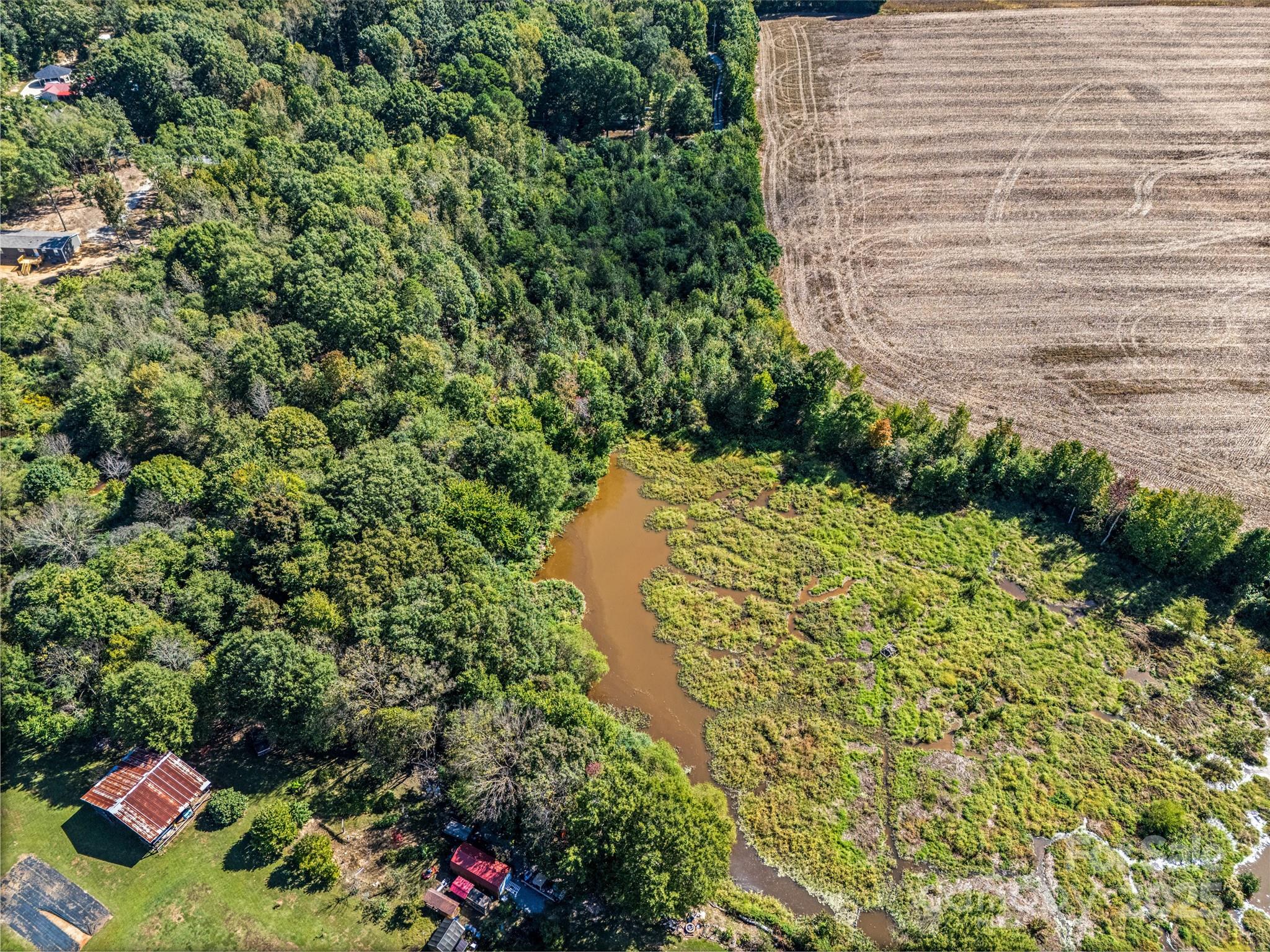 0 Lonnie D Aldridge Road Monroe, NC 28112 - Photo 5 of 18 a view of a yard with plants and wooden fence