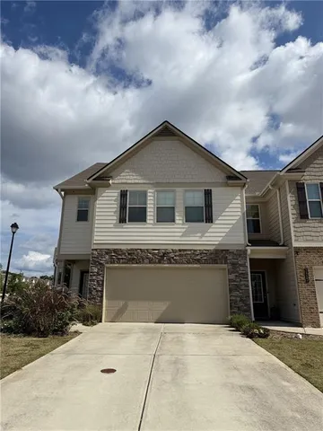 a front view of a house with yard