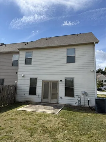 a view of a backyard with a table and chair
