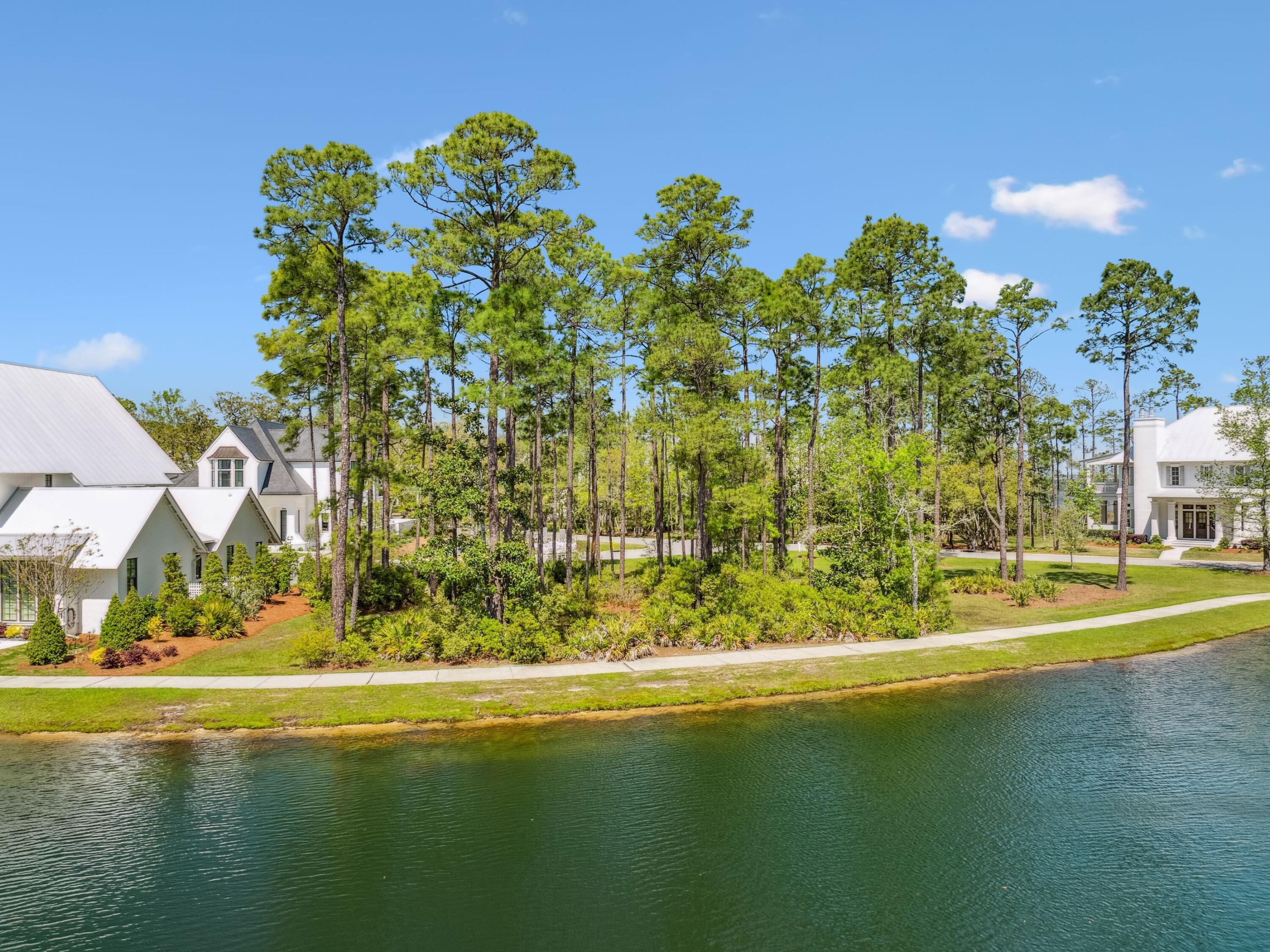 Lot 48 Perrin Santa Rosa Beach Santa Rosa Beach, FL 32459 - Photo 5 of 17 a view of a swimming pool with an outdoor space and seating area