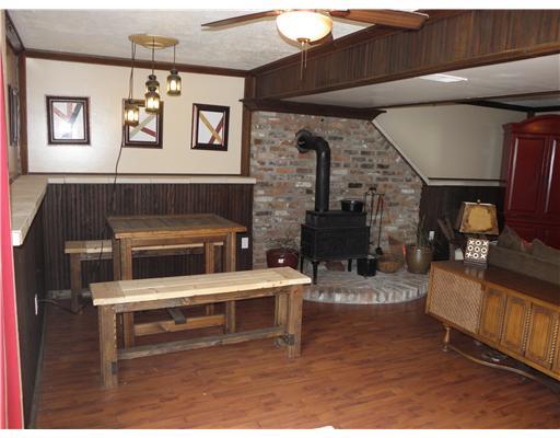 100 Nantucket Road Monongahela, PA 15063 - Photo 14 of 18 Den/Family/Great Room. Wood Burning Stove on Beautiful Brick Platform in Huge Game Room w/ Oak Trim and Crown Molding