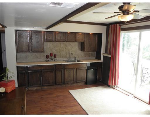 100 Nantucket Road Monongahela, PA 15063 - Photo 15 of 18 Den/Family/Great Room. Oak Cabinets w/ Ceramic Tile Counter Top and Backsplash w/ over head lighting. Sliding Glass Door to Patio.... Great for BBQs