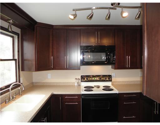 100 Nantucket Road Monongahela, PA 15063 - Photo 4 of 18 Kitchen. Fabulous Updated Kitchen w/ Newer Counter Tops, Cherry Cabinets & Heritage Hickory Pergo Flooring. Beautiful Contemporary Lighting & HUGE Pantry w/ Shelves.