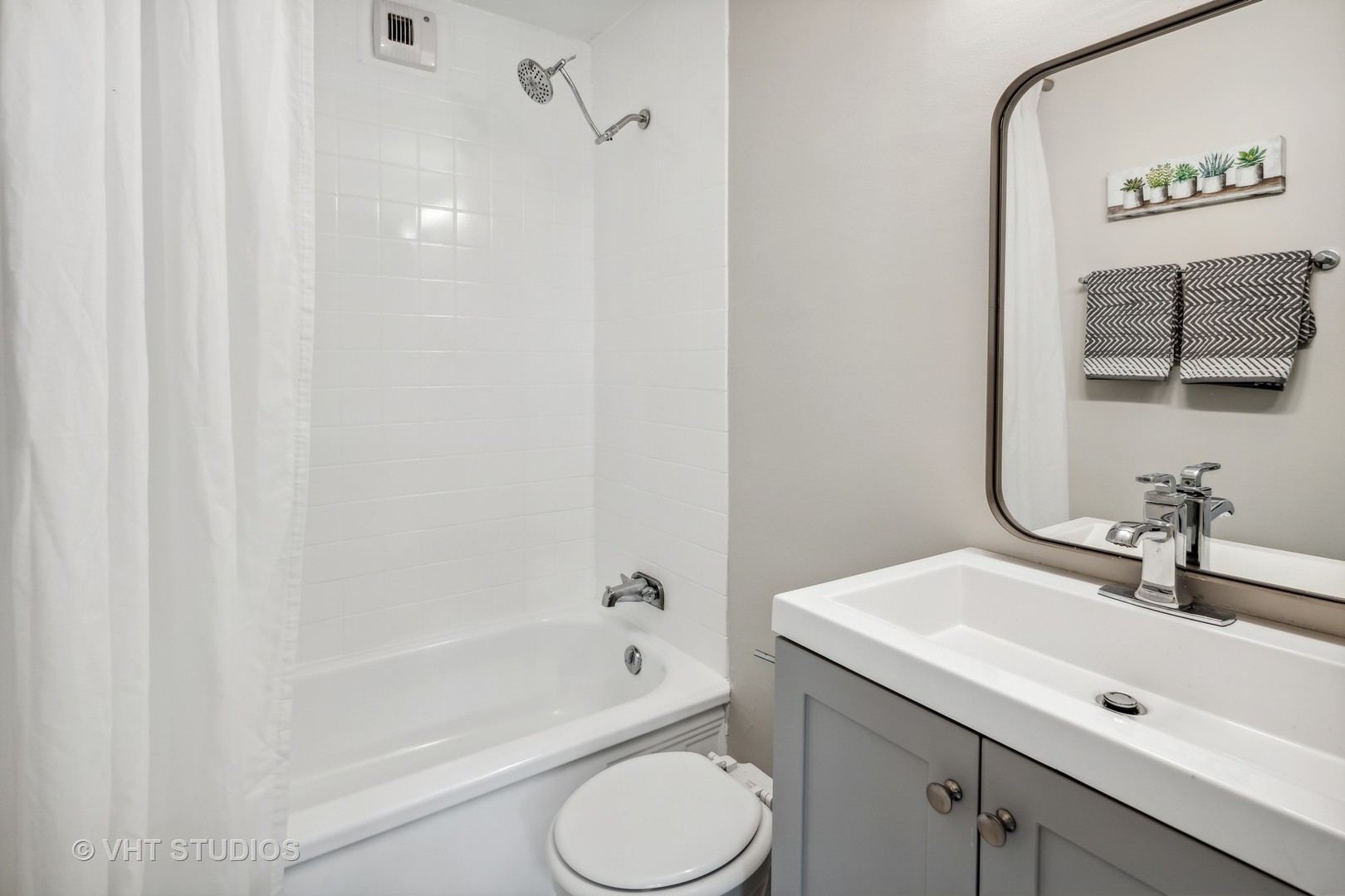 1540 North State Parkway, Unit 3D Chicago, IL 60610 - Photo 12 of 15 a bathroom with a sink toilet and shower