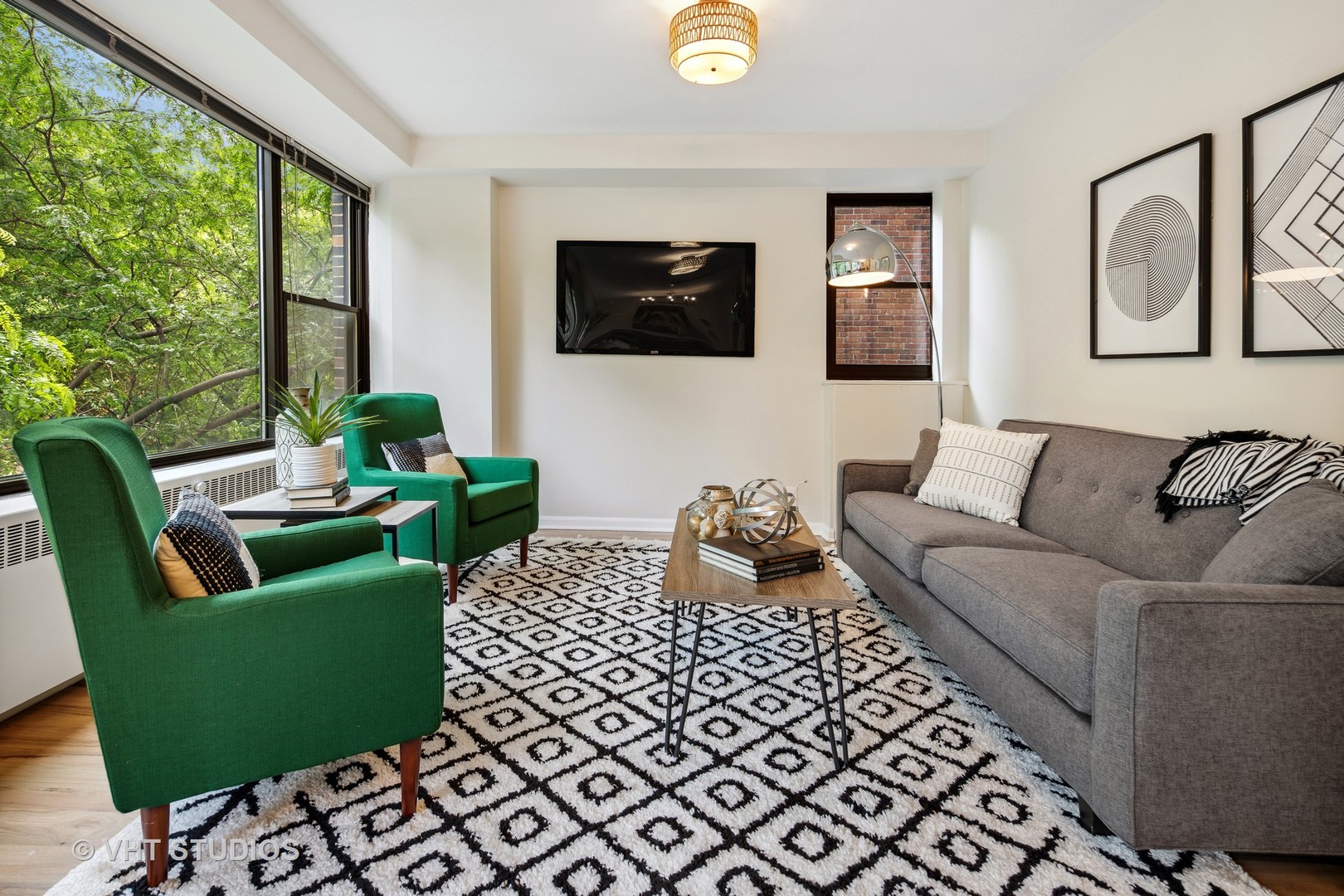 1540 North State Parkway, Unit 3D Chicago, IL 60610 - Photo 2 of 15 a living room with furniture and a flat screen tv