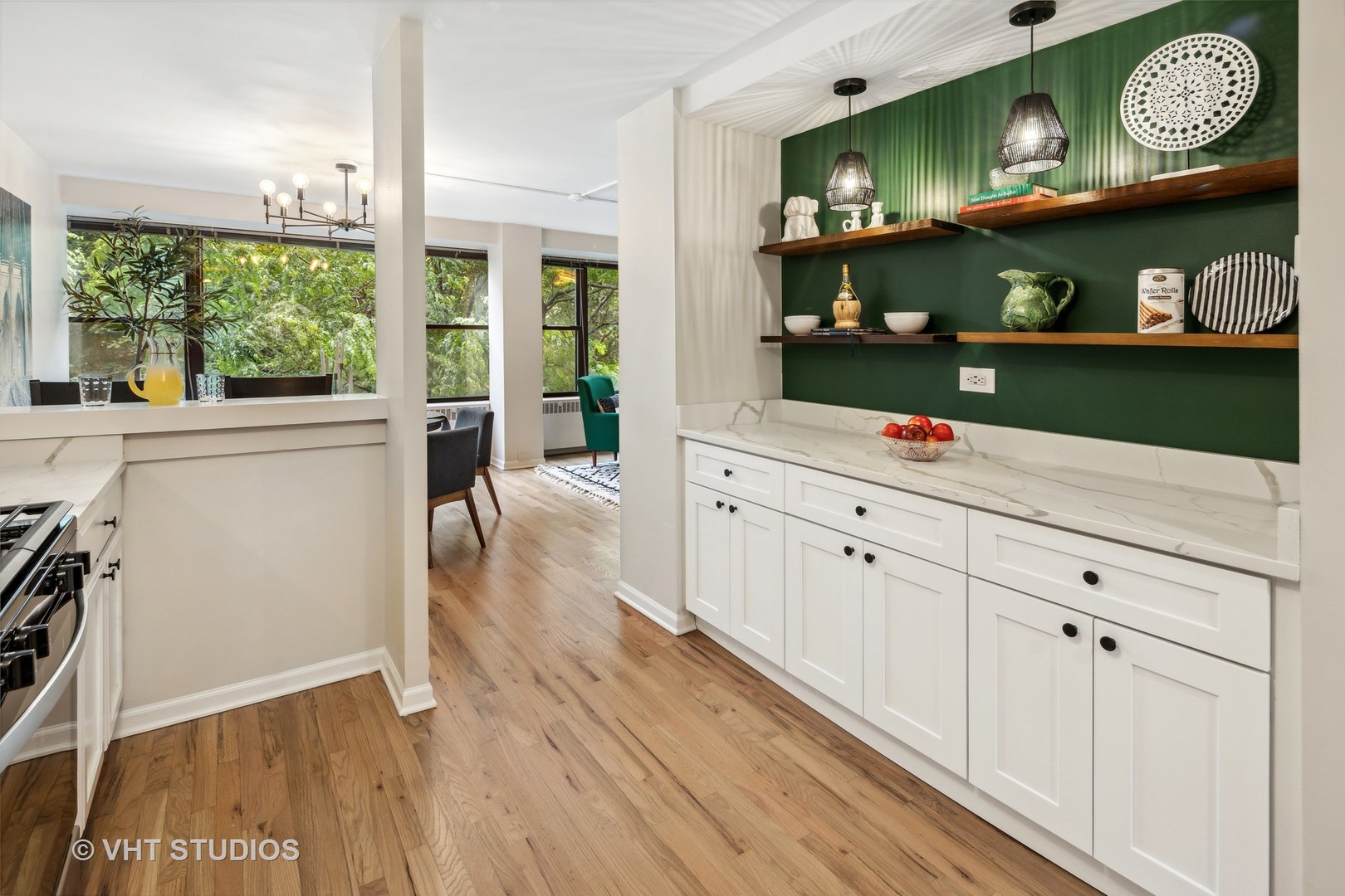 1540 North State Parkway, Unit 3D Chicago, IL 60610 - Photo 8 of 15 a open kitchen with white cabinets and wooden floor