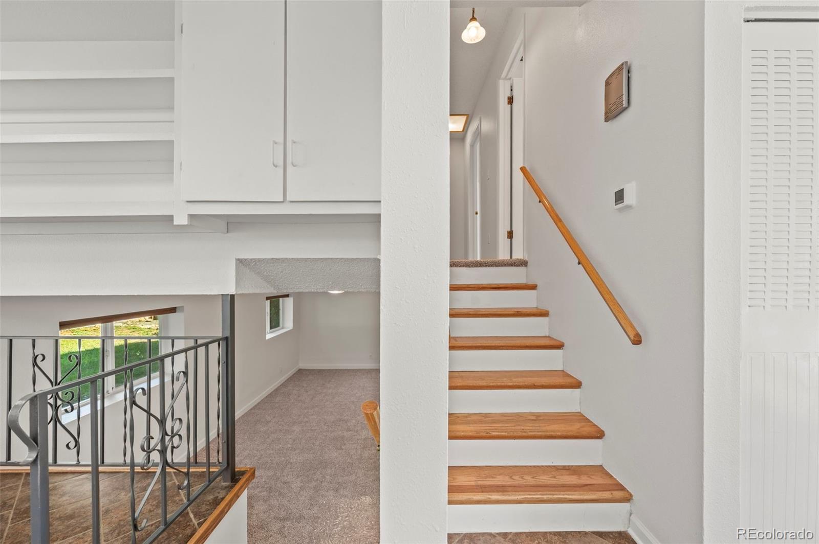 4420 South Vivian Way Morrison, CO 80465 - Photo 15 of 50 a view of entryway and hall with wooden floor