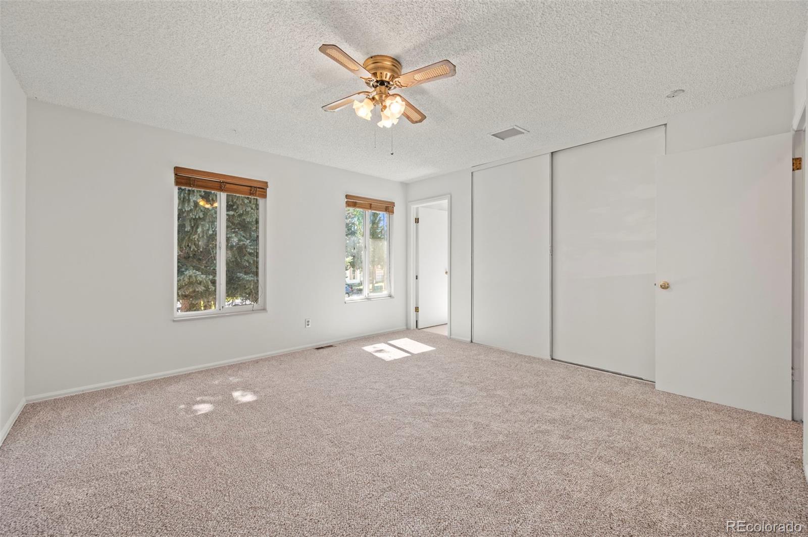 4420 South Vivian Way Morrison, CO 80465 - Photo 17 of 50 a view of an empty room with a window