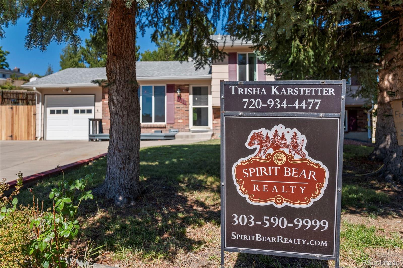 4420 South Vivian Way Morrison, CO 80465 - Photo 2 of 50 a sign on the side of a building