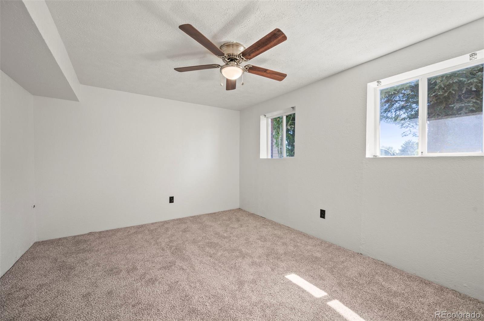 4420 South Vivian Way Morrison, CO 80465 - Photo 30 of 50 a view of an empty room with a window