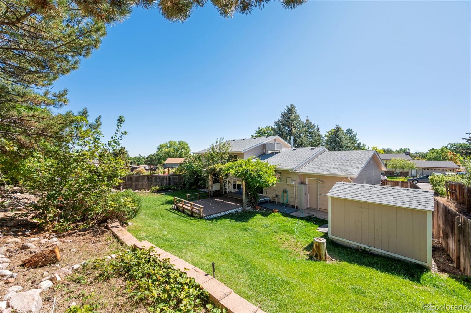 4420 South Vivian Way Morrison, CO 80465 - Photo 37 of 50 an aerial view of a house with a yard