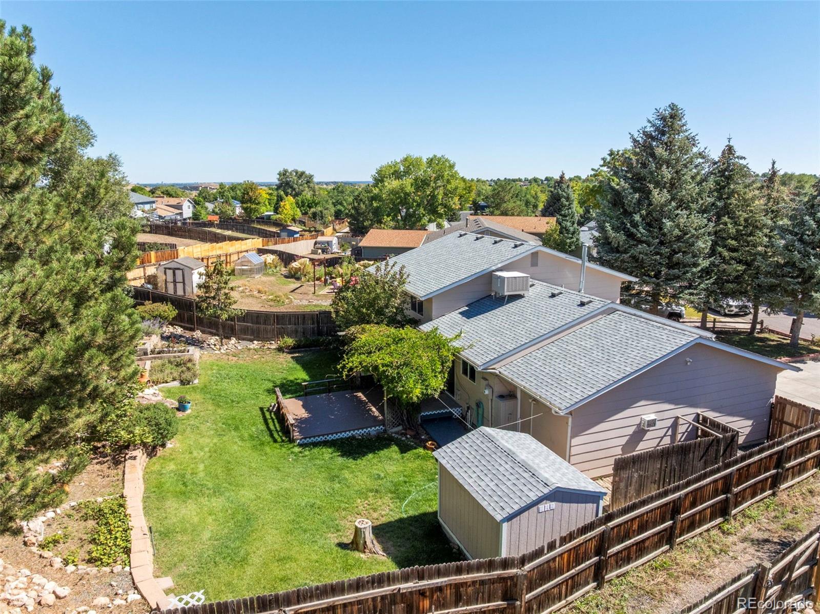 4420 South Vivian Way Morrison, CO 80465 - Photo 43 of 50 an aerial view of a house with a garden