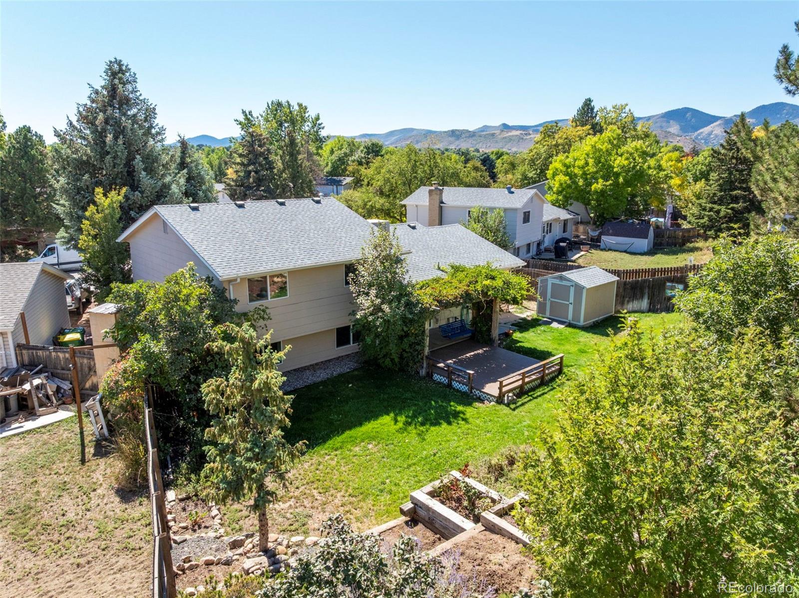 4420 South Vivian Way Morrison, CO 80465 - Photo 44 of 50 a aerial view of a house with garden space and street view