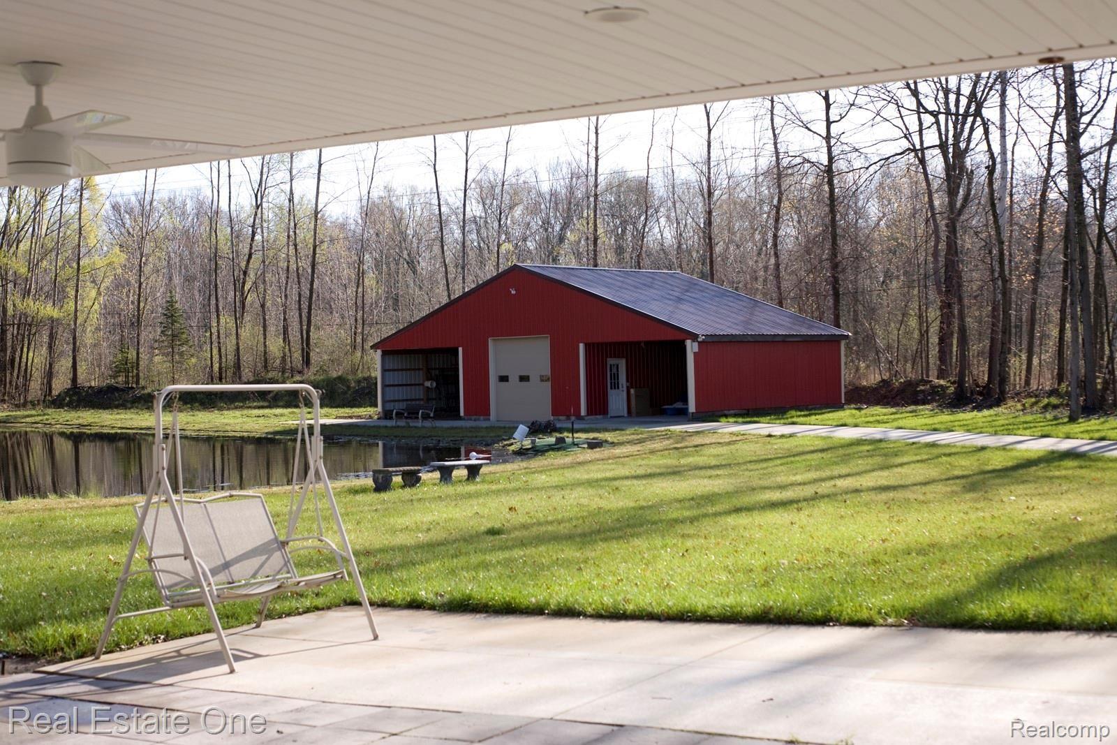 42560 Willis Road Belleville, MI 48111 - Photo 37 of 70 HUGE COVERED PATIO AREA.