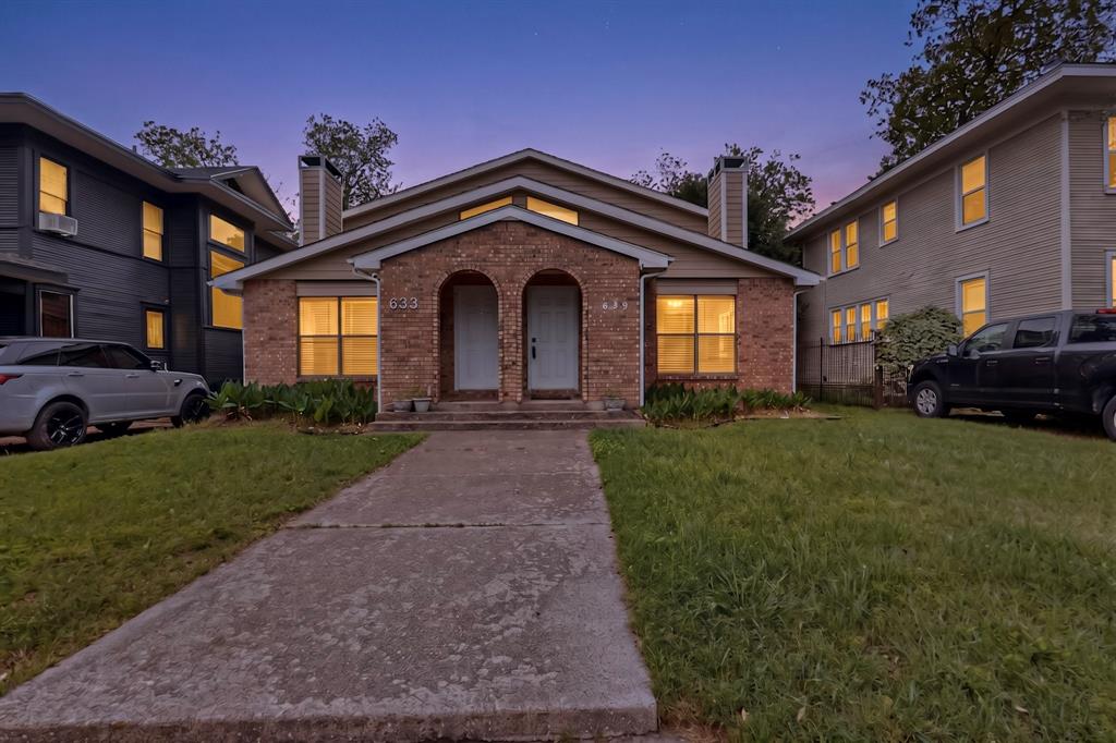 635 Haines Avenue Dallas, TX 75208 - Photo 1 of 36 a front view of a house with a garden