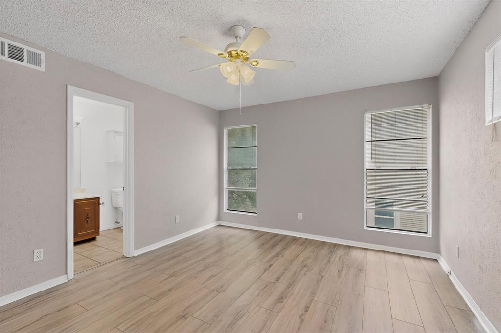 635 Haines Avenue Dallas, TX 75208 - Photo 23 of 36 wooden floor in an empty room with a window