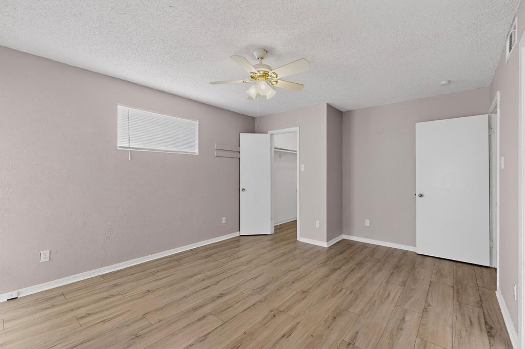 635 Haines Avenue Dallas, TX 75208 - Photo 26 of 36 a view of an empty room with wooden floor
