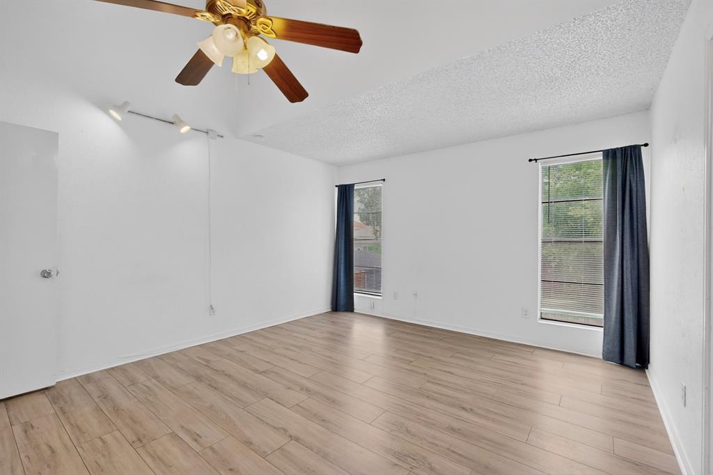 635 Haines Avenue Dallas, TX 75208 - Photo 31 of 36 wooden floor in an empty room with a window