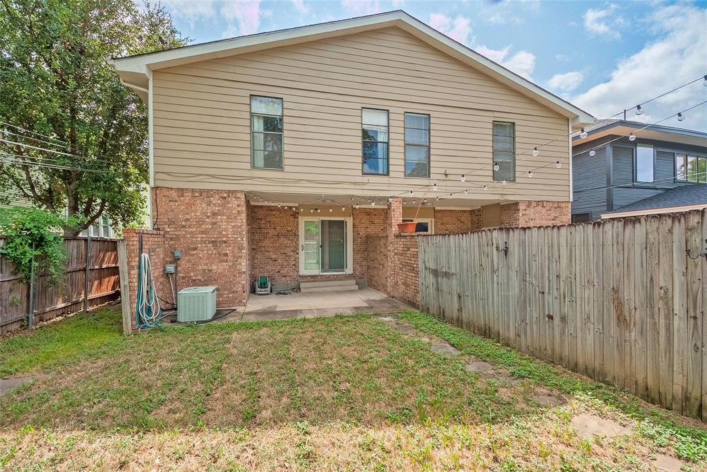 635 Haines Avenue Dallas, TX 75208 - Photo 36 of 36 a front view of a house with a yard and garage