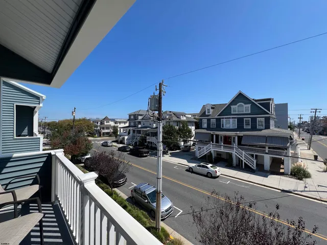 a view of car parked on the roadside