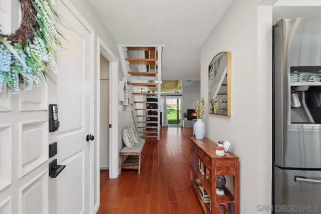 a room with furniture a rug and a book shelf
