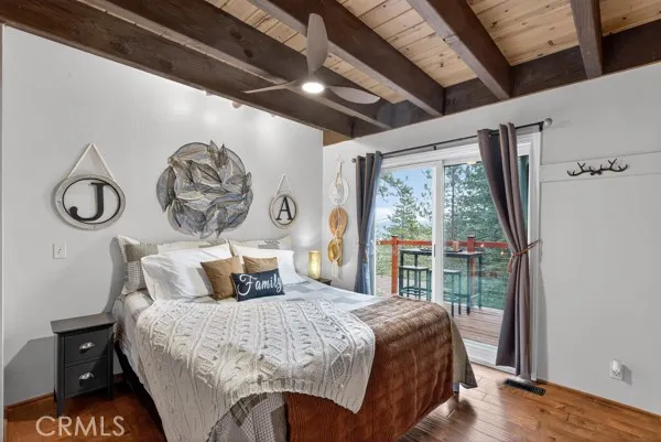 a bedroom with a large bed and a window
