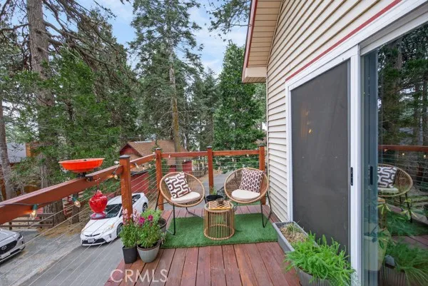 a view of a chairs and table on the deck