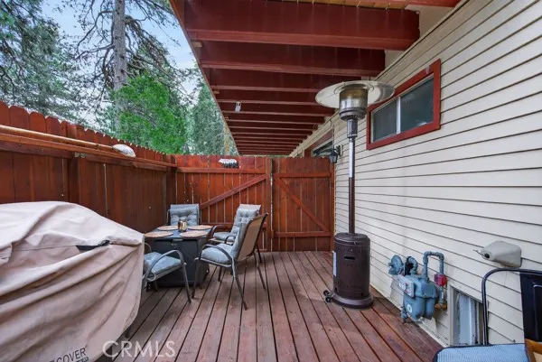 a view of balcony with wooden floor and outdoor seating