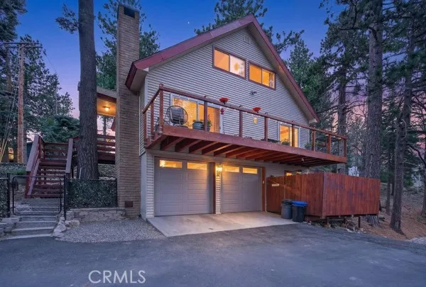 a front view of a house with a garage