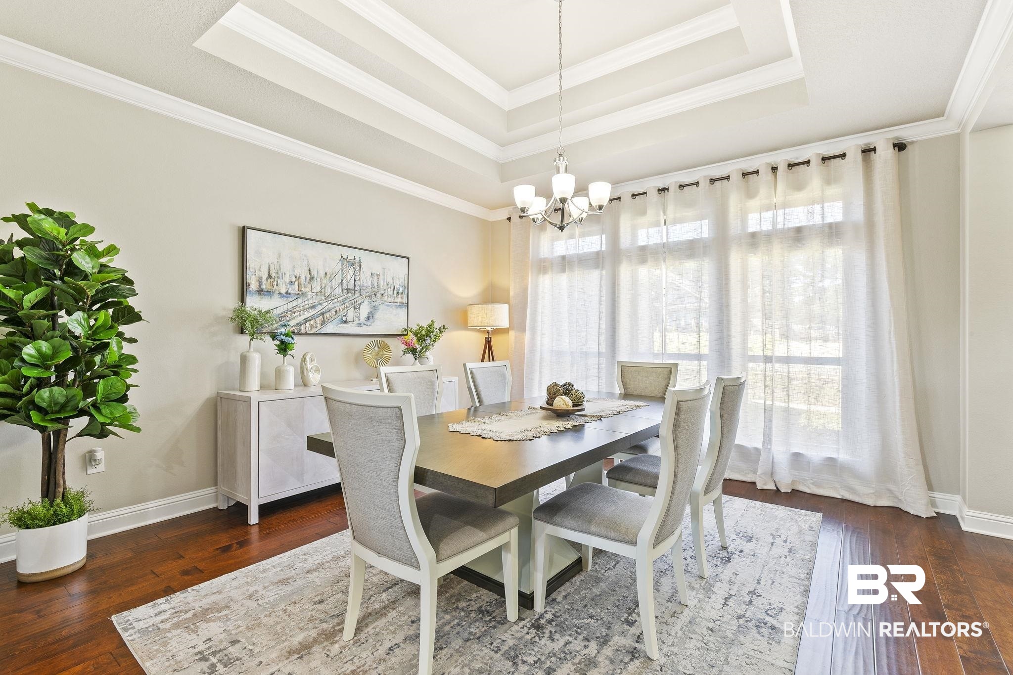 31500 Spoonbill Road Daphne, AL 36527 - Photo 13 of 85 Dining room with dark wood-type flooring, an inviting chandelier, and ornamental molding
