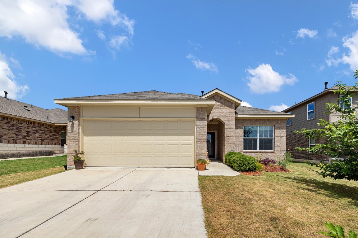 1608 Deodara Drive Cedar Park, TX 78613 - Photo 1 of 1 a front view of a house with a yard and garage