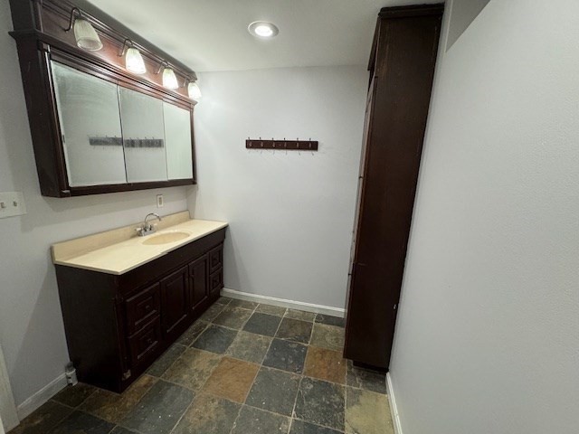 70 Riley Switch Road Phillipston, MA 01331 - Photo 16 of 19 a bathroom with a sink vanity and a mirror
