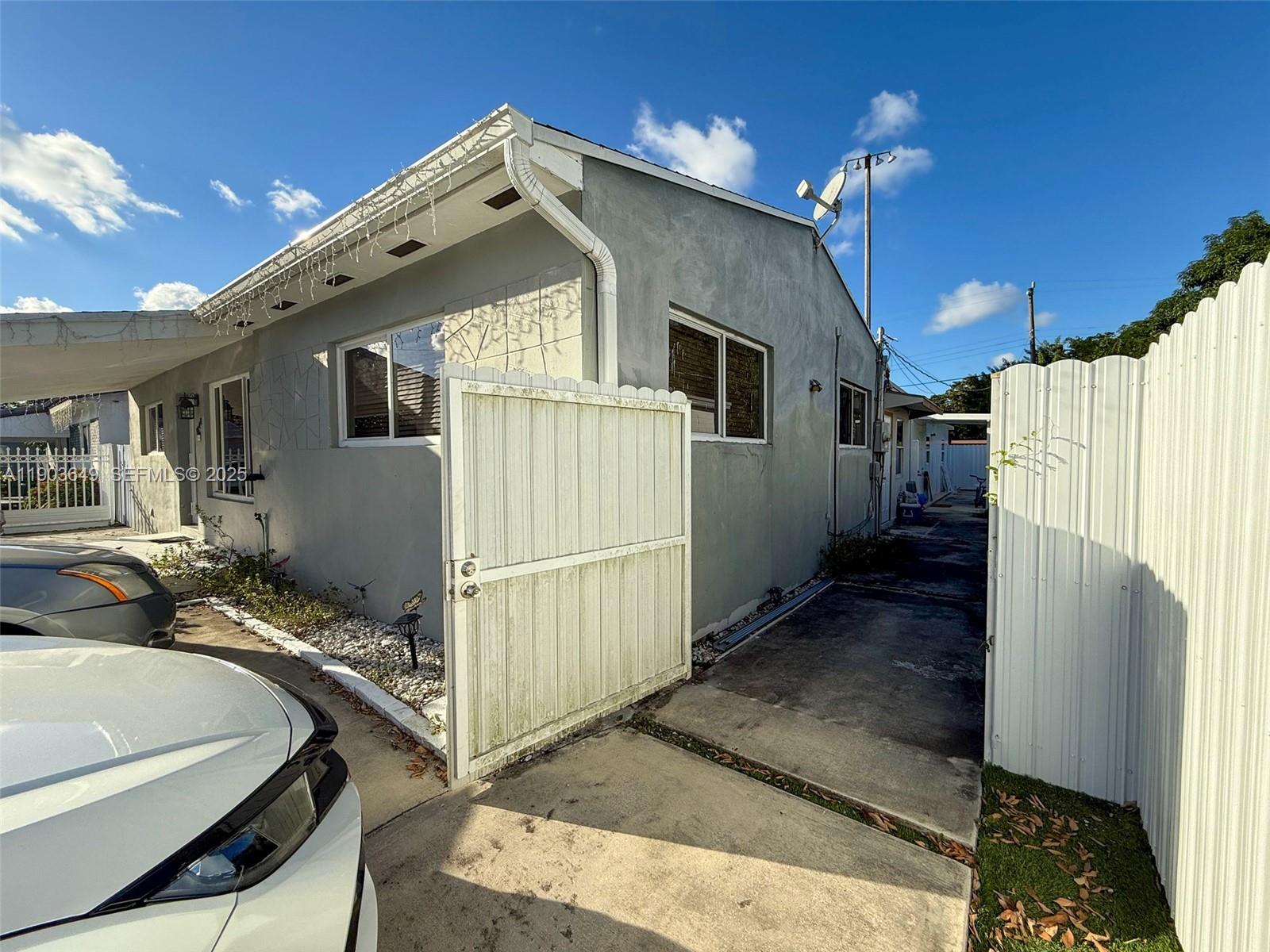 1545 Northwest 85th Street Miami, FL 33147 - Photo 11 of 16 a bathroom with a sink a mirror and a shower