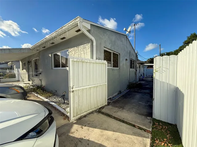 a bathroom with a sink a mirror and a shower