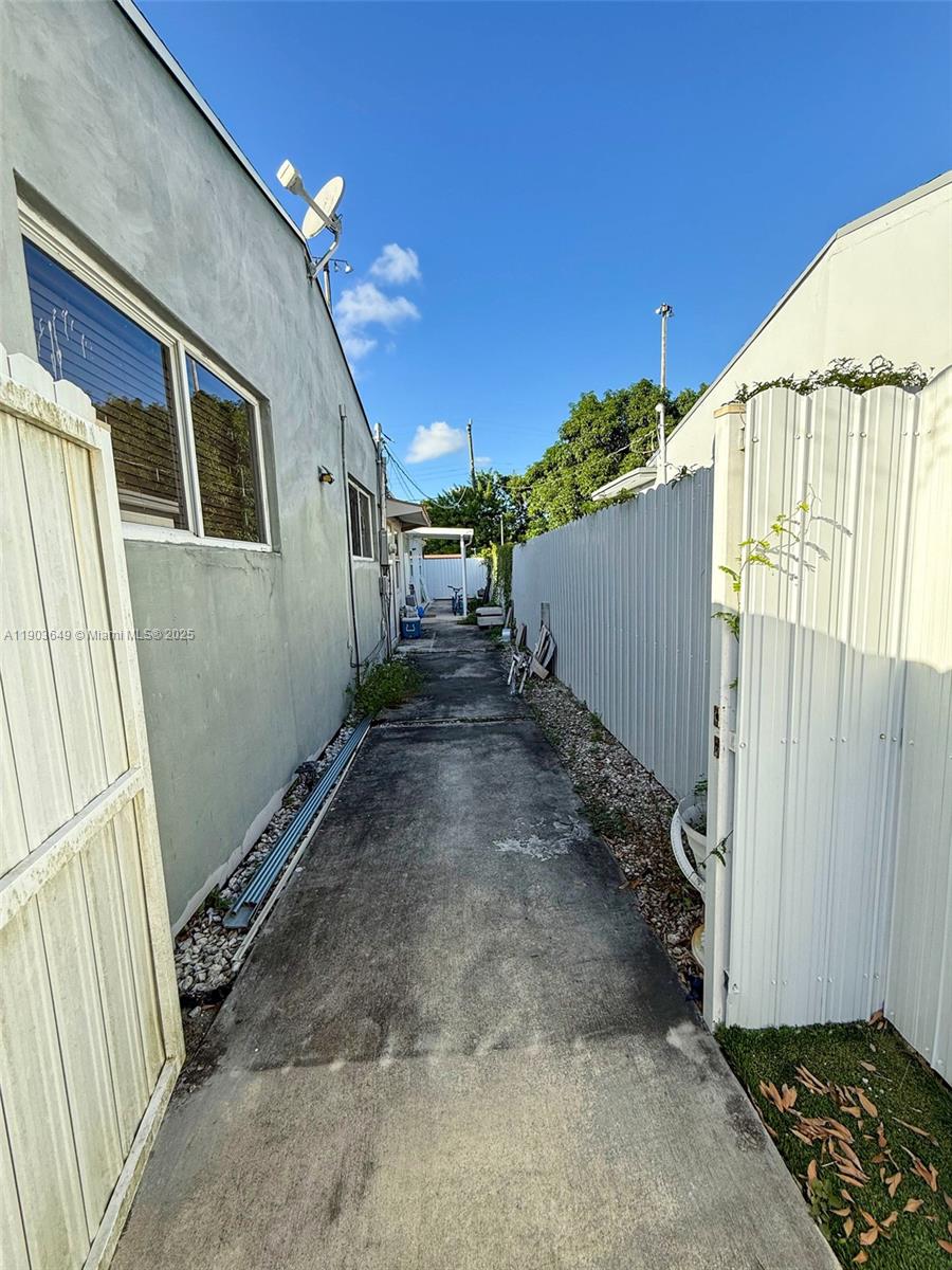 1545 Northwest 85th Street Miami, FL 33147 - Photo 12 of 16 a view of a house with a backyard